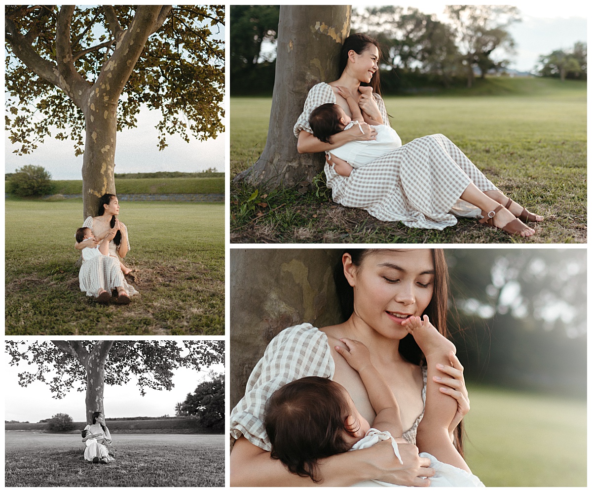 mom nurses baby girl under a tree by Nikki Meer Photography