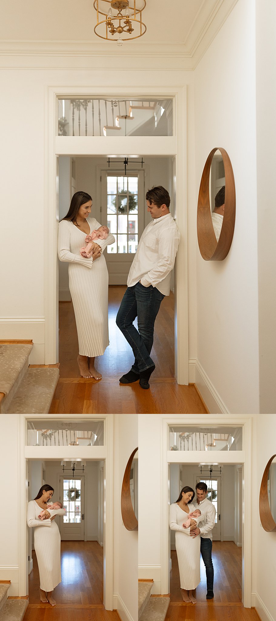 man and woman stand in hallway holding their daughter by Nikki Meer Photography