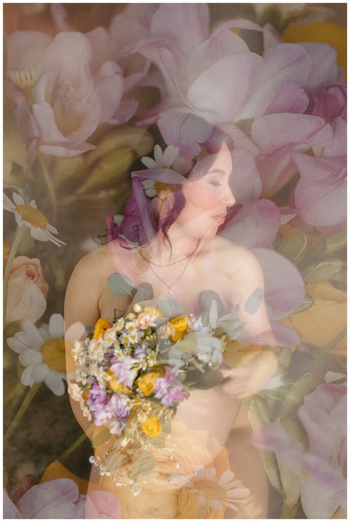 pregnant woman covers herself with bouquet of flowers during Studio Muse Maternity Session