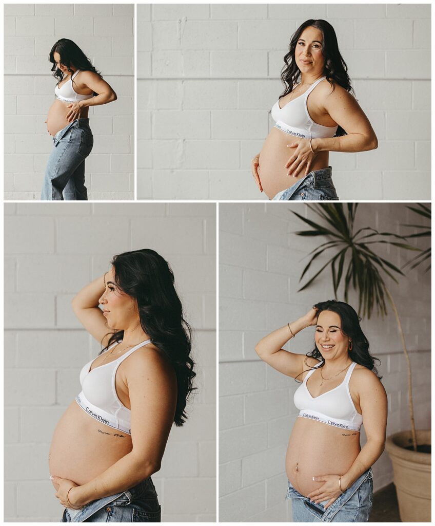 mom-to-be holder her baby bump and smiles by Virginia Beach Photographer