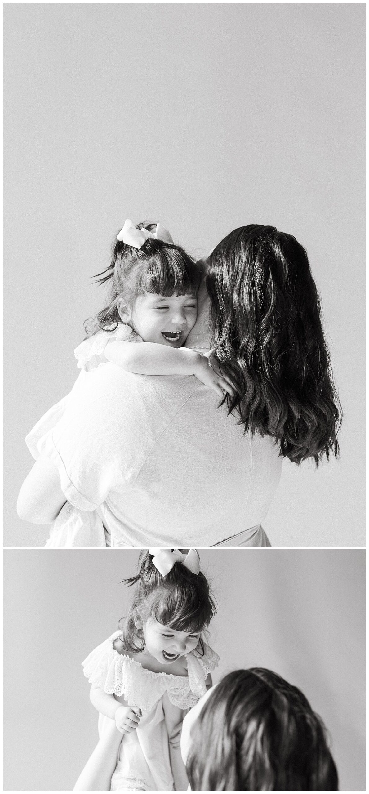mother holds daughter close as she laughs during studio family session
