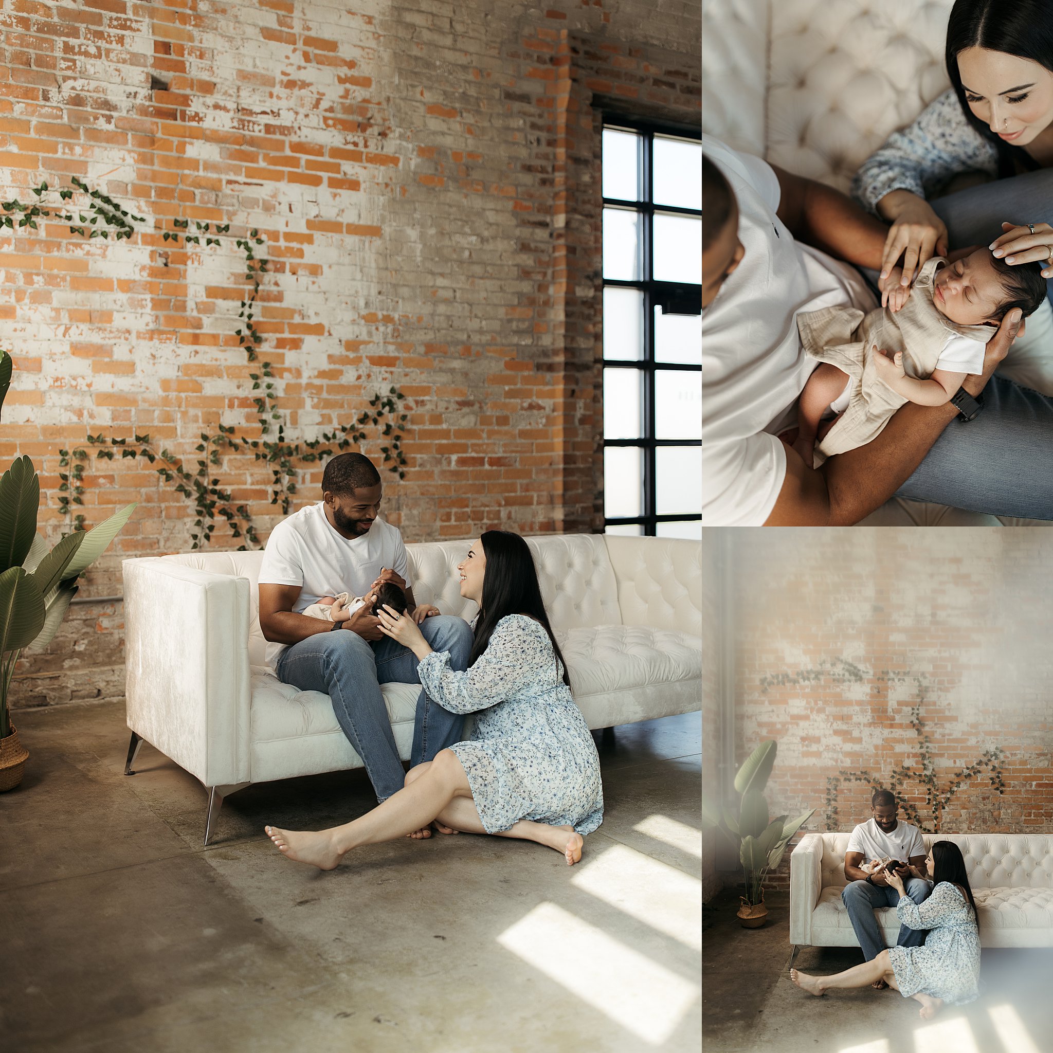 man sits on couch holding son while mom smiles at him at studio newborn session
