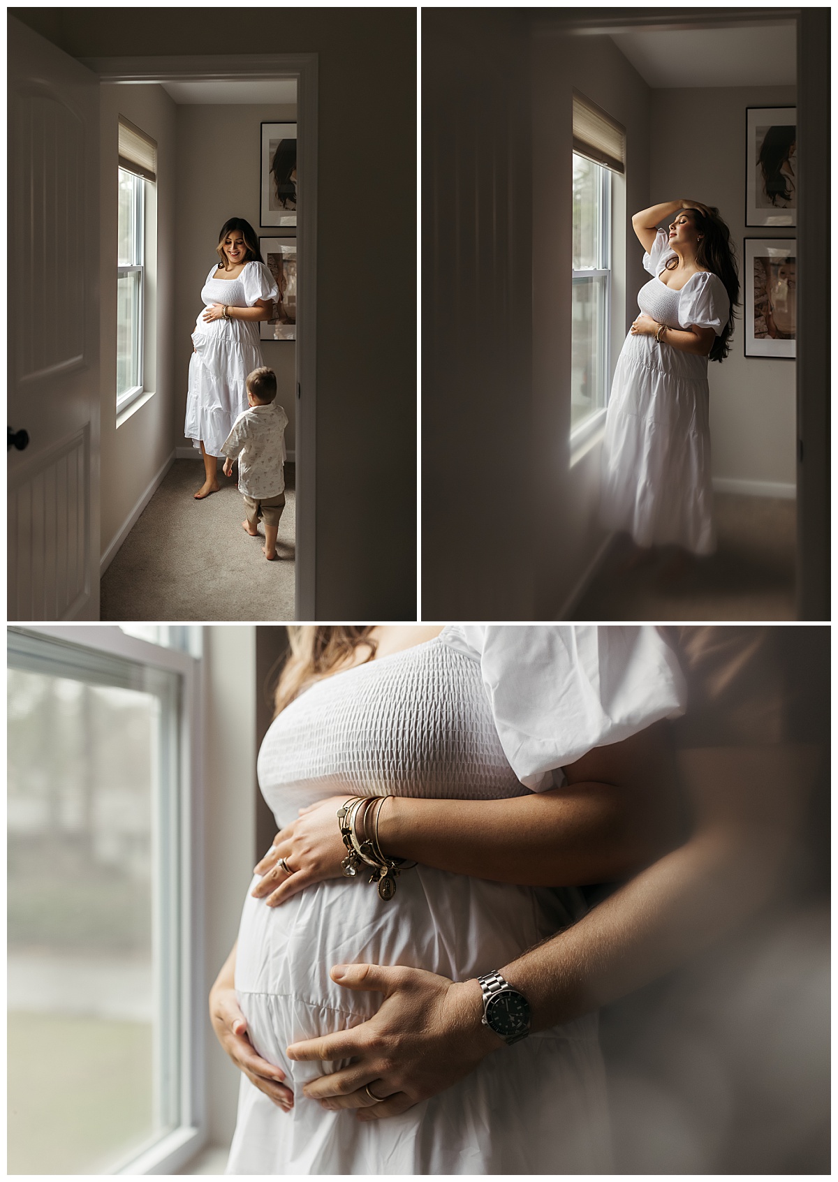 woman runs her hands through her hair as she stands in front of window during maternity session with a busy toddler