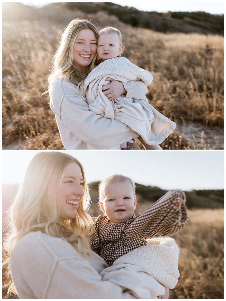 woman grins holding baby by Nikki Meer Photography