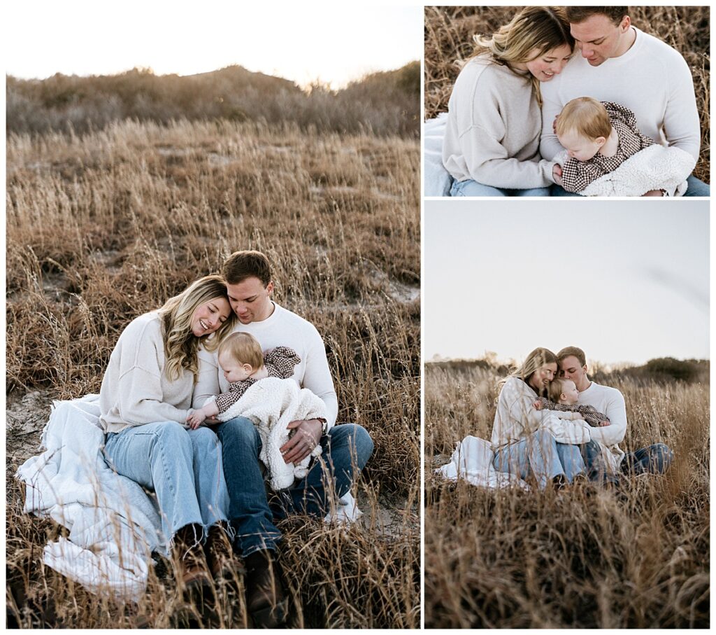 parents and child sit on blanket snuggled together by Virginia Beach photographer