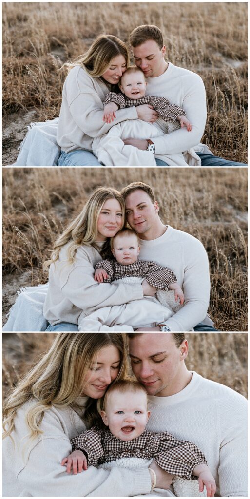 man and woman hold daughter between them by Nikki Meer Photography