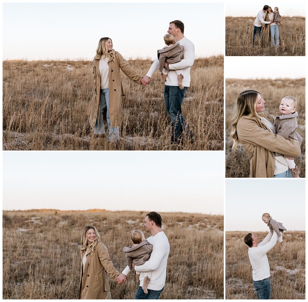 man and woman hold hands walking through brown grass with child by Nikki Meer Photography